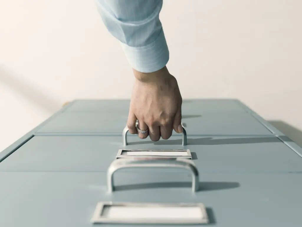 Secretary searching files in the filing cabinet